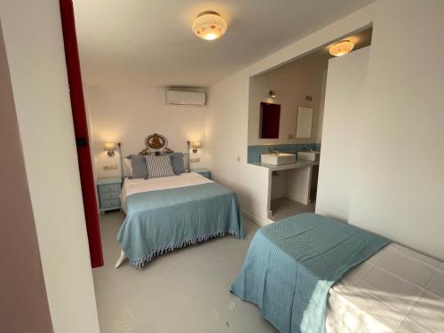 Ένα ή περισσότερα κρεβάτια σε δωμάτιο στο Villas en Toledo