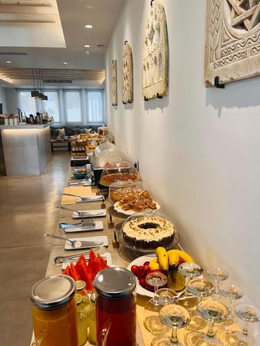 a buffet line with many different types of food at Lithos Luxury Suites in Tinos Town