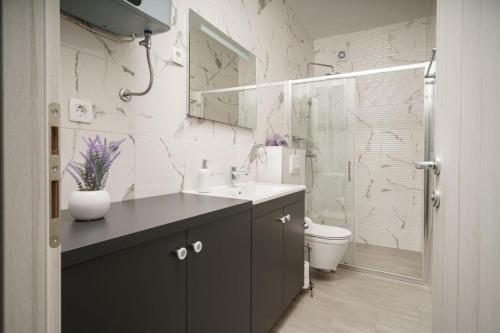 a bathroom with a sink and a toilet at Apartment Stefanio in Vodice