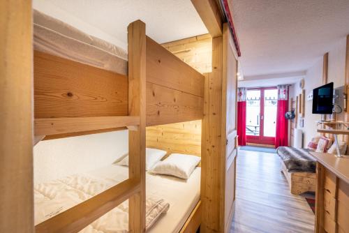 a room with two bunk beds in it at Studio Les Saisies in Hauteluce