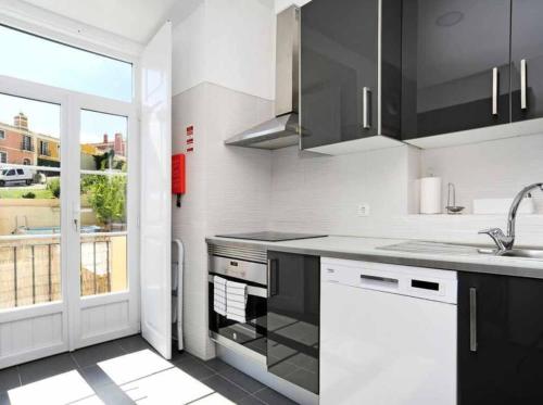 a kitchen with a sink and a counter top at Lightoasis Oeiras 1 in Oeiras