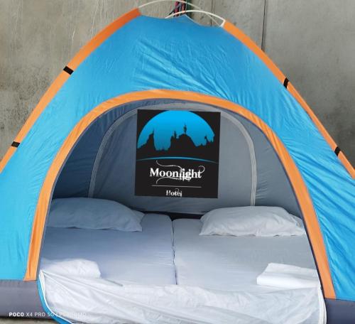 a blue and orange tent with a tv in it at Proyecto MOONLIGHT in Villavieja