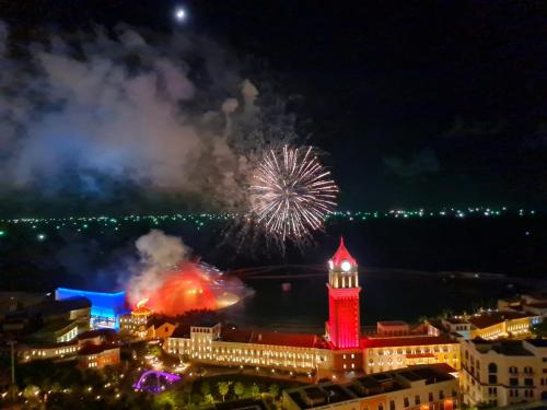 a firework display over a city at night at La Phan Phu Quoc, Hillside Apartment in Phu Quoc
