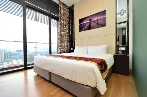 A bed or beds in a room at Dorsett Residences Service Suites Bukit Bintang Kl