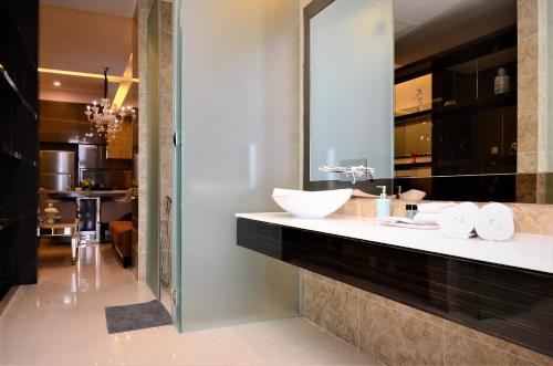 a bathroom with a sink and a mirror at Dorsett Residences Service Suites Bukit Bintang Kl in Kuala Lumpur