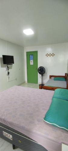 Katil atau katil-katil dalam bilik di Guest House Renascer K&W