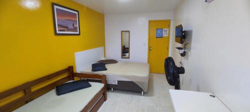 Katil atau katil-katil dalam bilik di Guest House Renascer K&W
