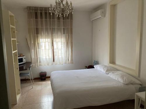 Ένα ή περισσότερα κρεβάτια σε δωμάτιο στο B&B LE AMARENE