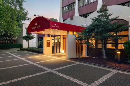 an empty parking lot in front of a building at Amedia Hotel Siegen City, Trademark Collection by Wyndham in Siegen