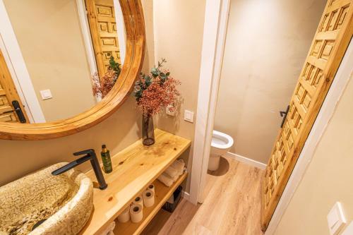 a bathroom with a sink and a mirror at Hotel BESTPRICE Santillana in Santillana del Mar