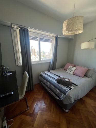 Ένα ή περισσότερα κρεβάτια σε δωμάτιο στο Buenos Aires Amazing View