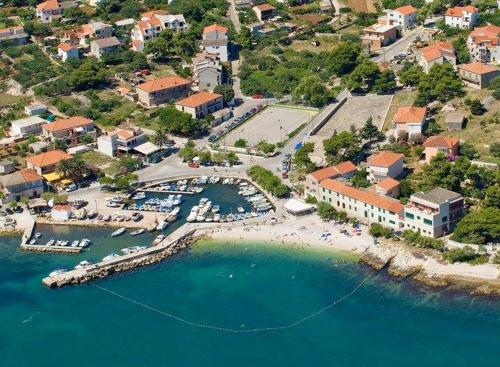 an aerial view of a beach with a resort at 2 bedrooms appartement at Slatine 250 m away from the beach with enclosed garden and wifi in Slatine