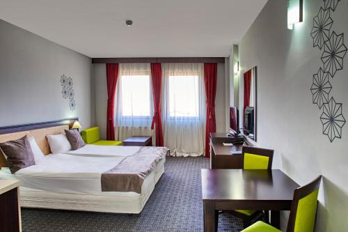 Postel nebo postele na pokoji v ubytování MPM Hotel Guinness