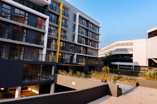 an exterior view of an apartment building at Glorystar The Millennial Umhlanga in Durban