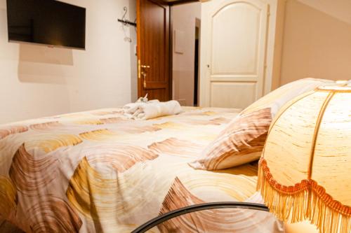 a dog laying on a bed in a room at B&B Casa del Pietro in Pieve San Giovanni
