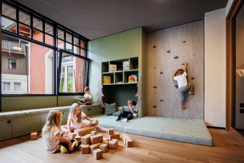 a childrens room with a rock climbing wall at Hotel Vioz in Peio Fonti