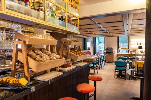 a bakery with a display of bread and pastries at Arts Hotel Porto, Tapestry Collection By Hilton in Porto