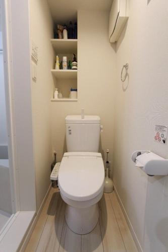 a bathroom with a white toilet and a shower at Shibuya Stay Tokyo A204 in Tokyo