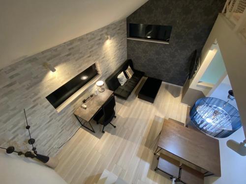 an overhead view of a living room with a fireplace at Shibuya Stay Tokyo A204 in Tokyo