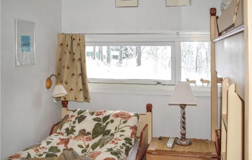 a bedroom with a bed and a window at Nice Apartment In Geilo With Kitchen in Geilo