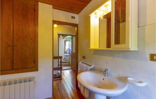 a bathroom with a sink and a mirror at Lovely Apartment In Casoli Lu With Kitchen in Cocciglia