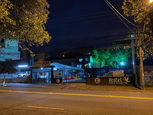 an empty street at night with a building in the background at HOSTEL FAMILIA ZANATTA in Caxias do Sul