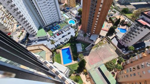 an overhead view of a city with tall buildings at Apartamento Edificio Acacias IV 19 in Benidorm