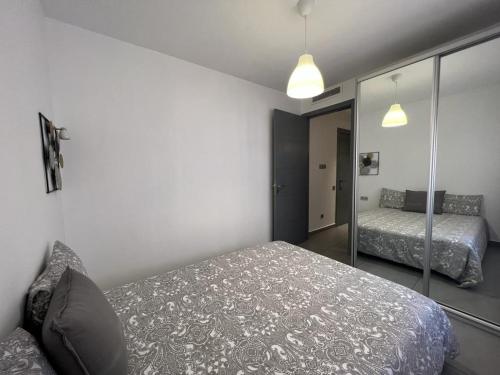 a bedroom with two beds and a mirror at AiM HOUSE in Marrakech