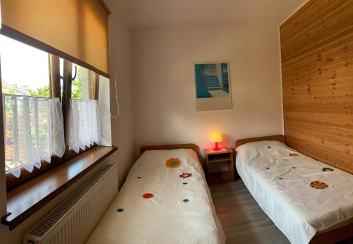 Postel nebo postele na pokoji v ubytování Apartamenty Jakob