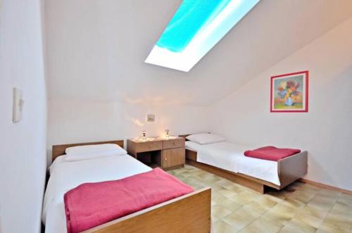 Posteľ alebo postele v izbe v ubytovaní Apartment Božiković - Jelsa - Vitarnja