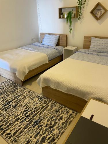 Ένα ή περισσότερα κρεβάτια σε δωμάτιο στο Golden Stone Beach