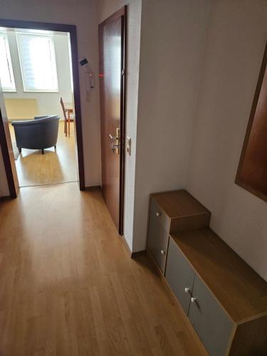 a room with a bathroom with a bath tub and a door at FeWo3 Köthen 