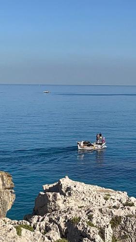 a group of people on a boat in the water at Golden Stone Beach in Halat Byblos