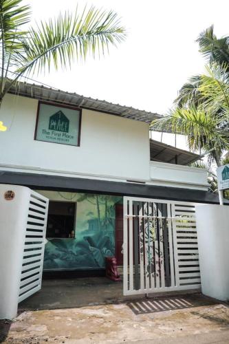 a building with a gate in front of it at The First Place Yogaresort, Odayam in Varkala