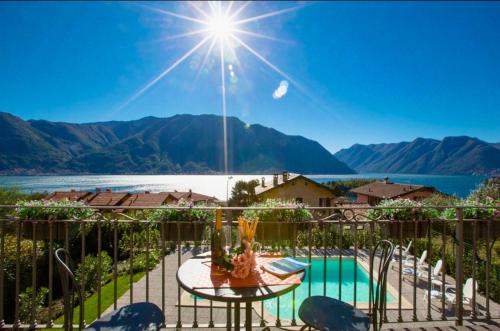 a view of the lake from the balcony of a house at La Bella Ossuccio in Ossuccio