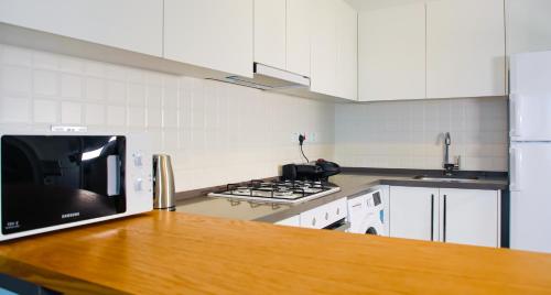 A cozinha ou cozinha compacta de Neron Apartments in Caesar Resort & SPA, Long Beach