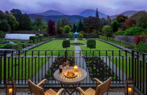 a view of a garden with a table and chairs at Inverlochy Castle Hotel in Fort William