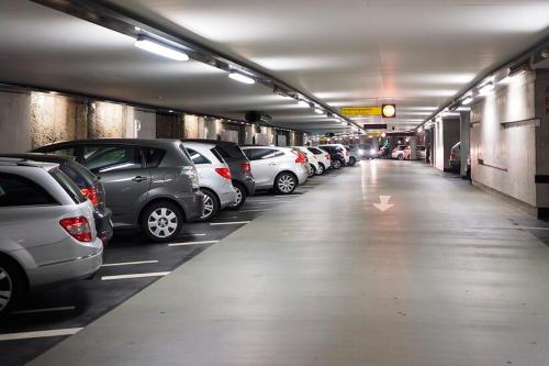 a parking garage filled with lots of parked cars at Temukistan in Temuco