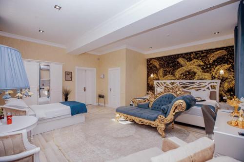 a large bedroom with two beds and a couch at HOTEL SILK ROAD EMPIRE SAMARKAND in Samarkand
