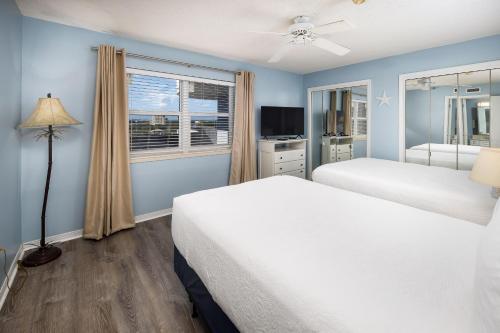 a bedroom with two beds and a window at Nautilus 2609 Gulf View 2 Bedroom 6th Floor Free Beach Service in Fort Walton Beach