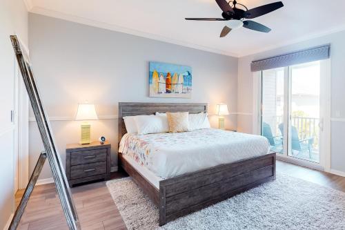 a bedroom with a bed and a ceiling fan at Madeira Beach Manor in St Pete Beach