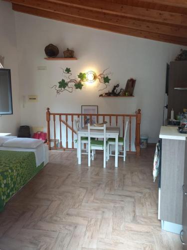 a dining room with a table and chairs in a room at Antico Borgo - A due passi dalle Gole Alcantara in Motta Camastra
