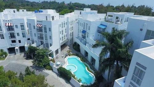 an aerial view of a building with a swimming pool at Slice of Paradise La Bella Residences in Tagaytay