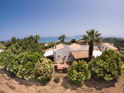 an aerial view of a house with trees at Kòre rooms in Castellammare del Golfo