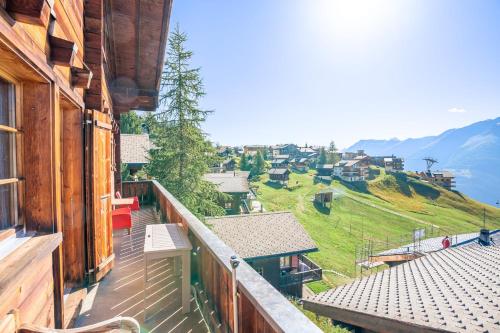 a balcony of a house with a view of a mountain at Chalet Collini in Riederalp