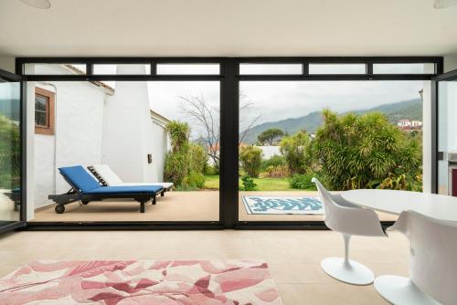a living room with a large sliding glass door at The El Paso in El Paso