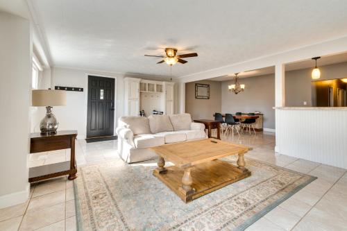 a living room with a couch and a table at Updated Robinson Vacation Rental with Fireplace! in Robinson