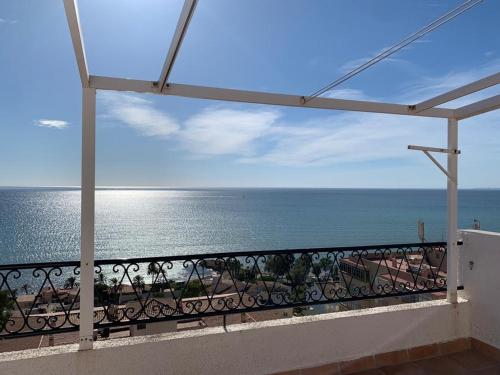 a view of the ocean from a balcony at Como en Casa 2 PARKING in Santa Pola