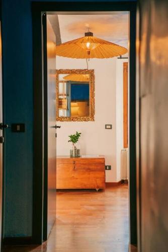 a room with a mirror and a dresser with a dresser sidx sidx sidx at Suite Cielo - Lago di Como in Blevio