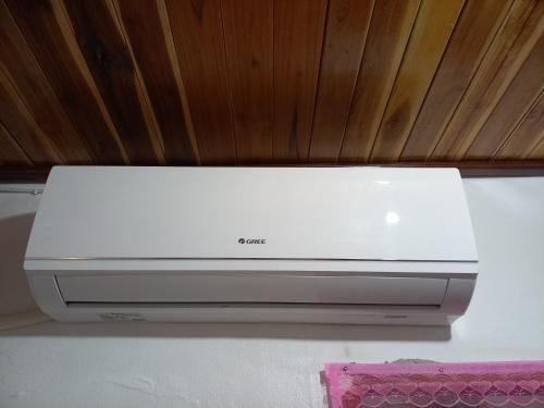 a white printer sitting on top of a table at watthat & Maladress GUESTHOUSE in Luang Prabang